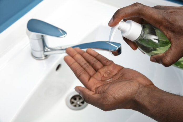 man-washing-hands-carefully-bathroom-close-up-prevention-infection